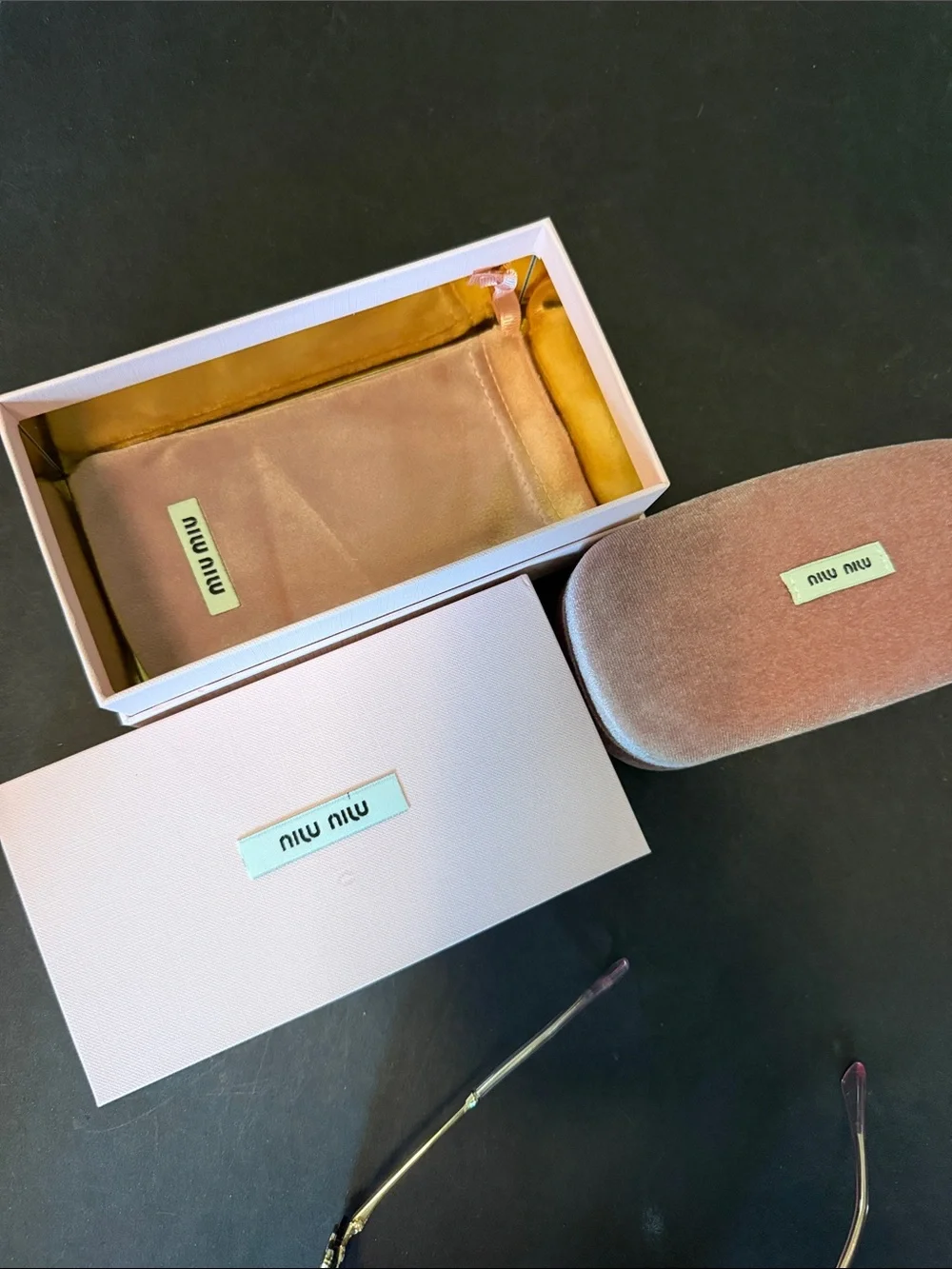 Miu Miu Rimless Sunglasses with Purple Gradient Lenses and Gold Accents